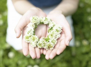 Woman with Wreath of Flowers in Her Hands